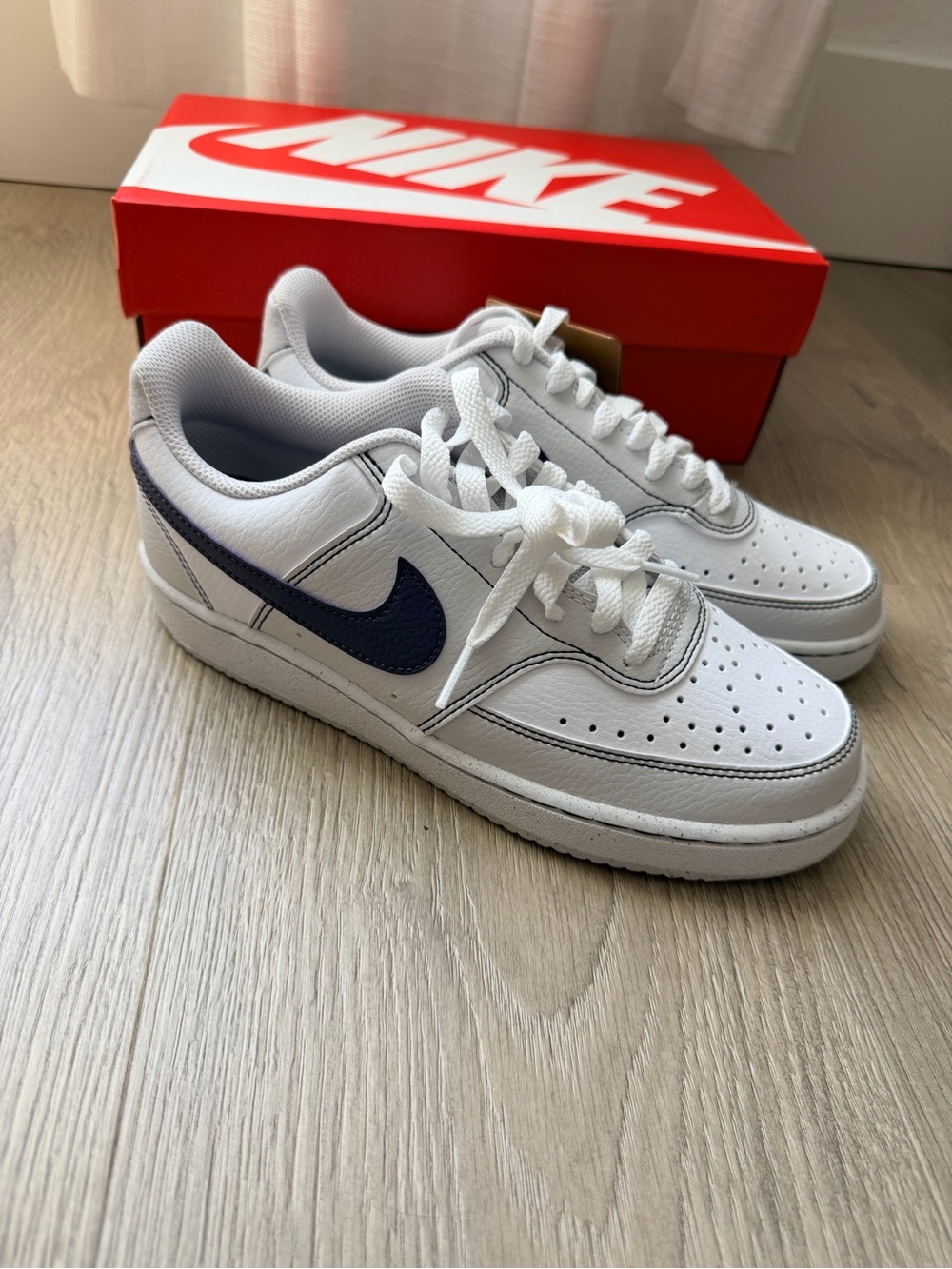Nike White Low-Top Sneakers with Navy Swoosh Accent